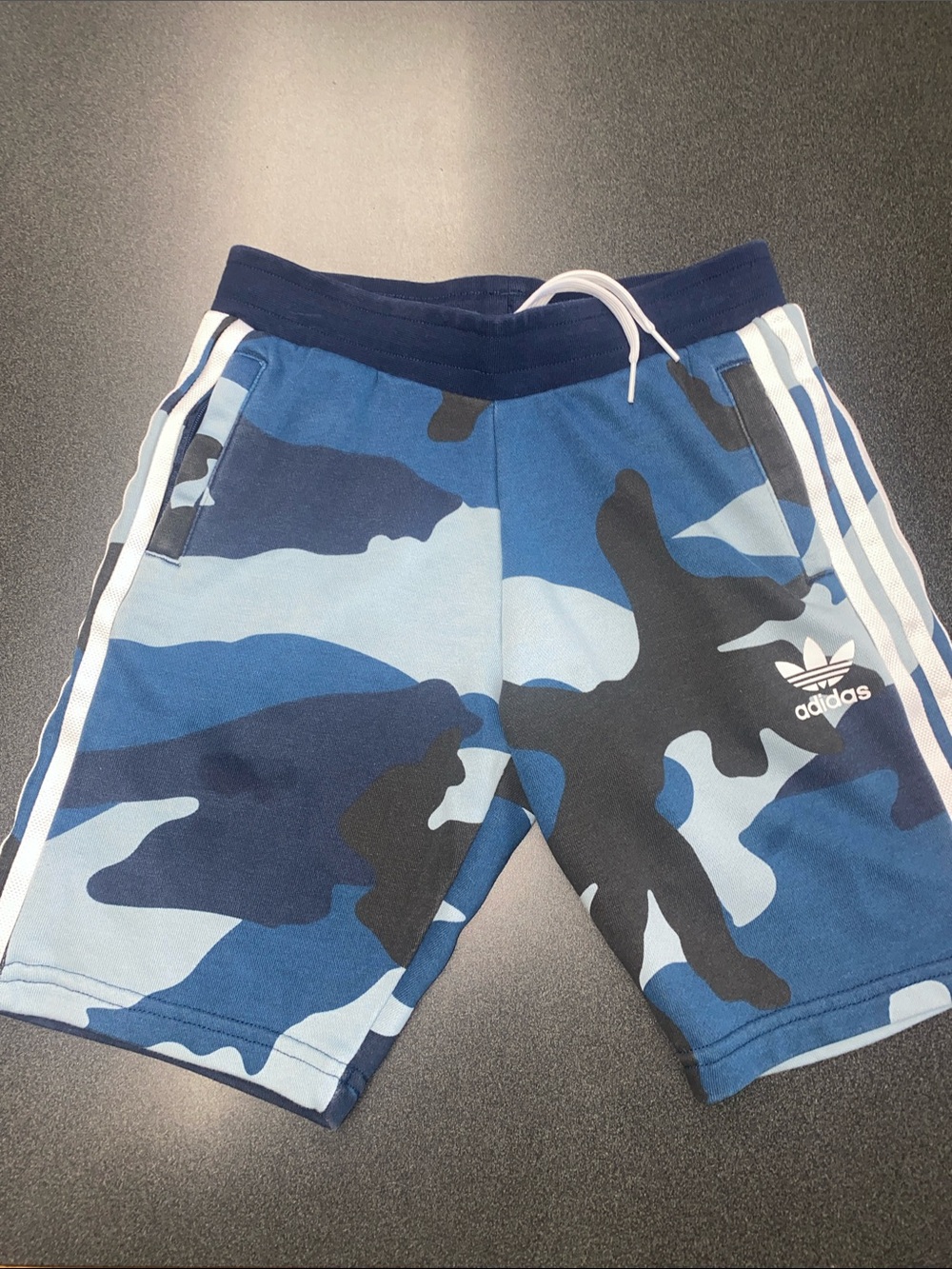 Boys Adidas size small ligh Blue and Navy camo Athletic Shorts with 3 stripes.